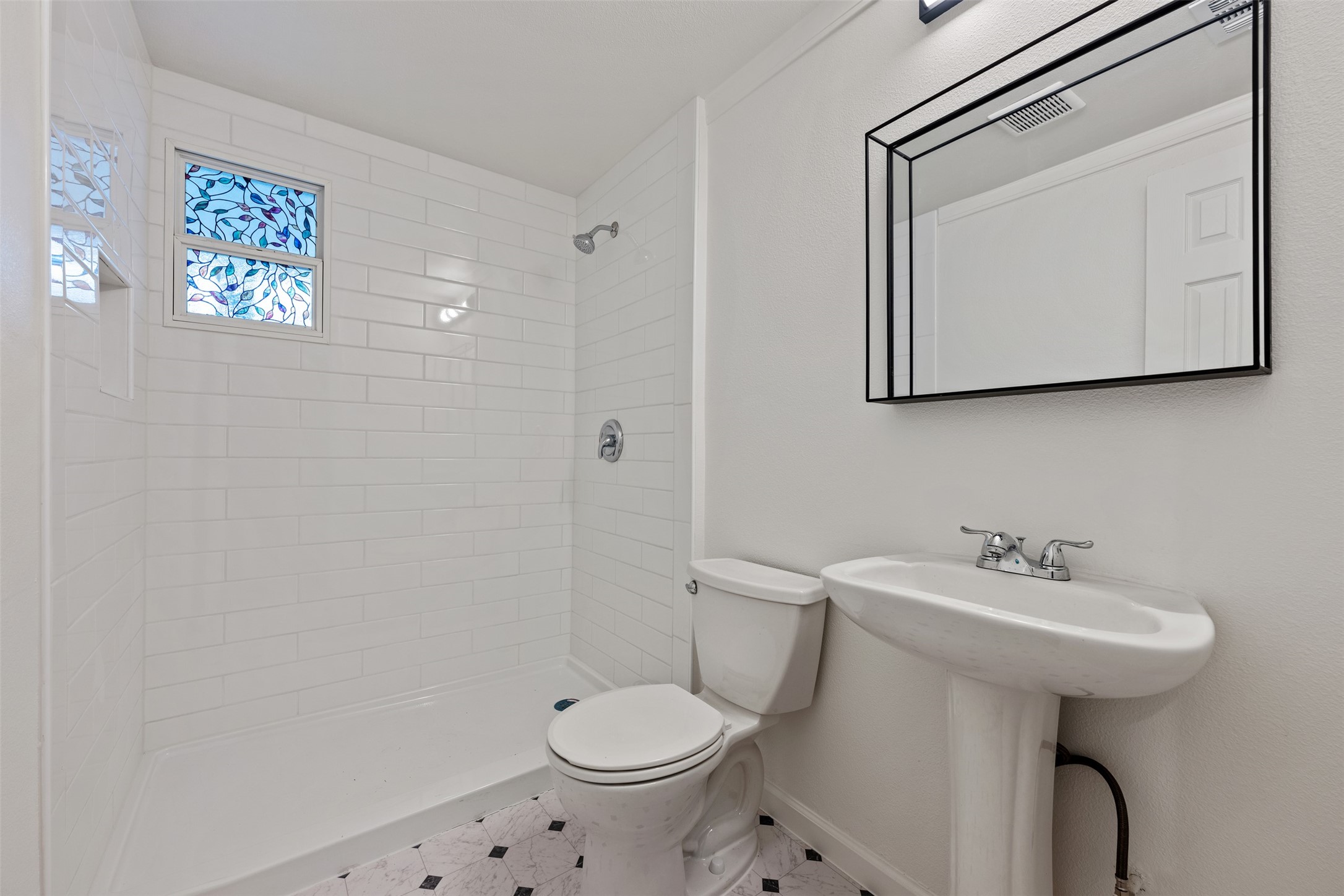 901 Valdez Street, Unit 13 Austin, TX 78741 - Photo 32 of 38 a bathroom with a sink toilet and mirror