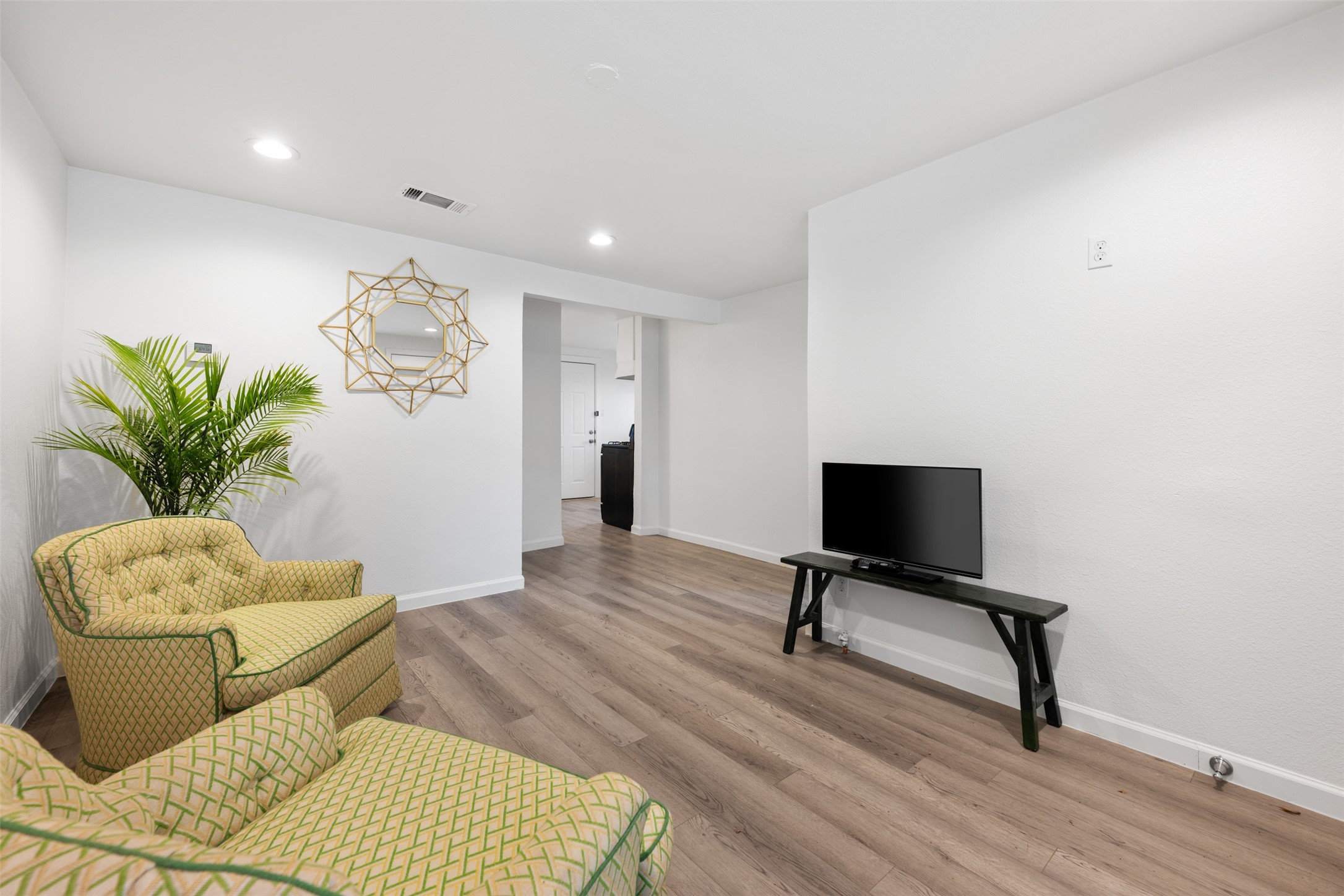 901 Valdez Street, Unit 13 Austin, TX 78741 - Photo 6 of 38 a living room with furniture lamp and a potted plant