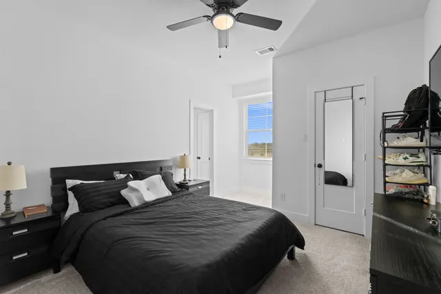 a bedroom with a bed and closet