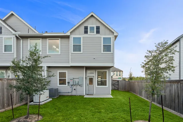 a front view of a house with a yard and porch