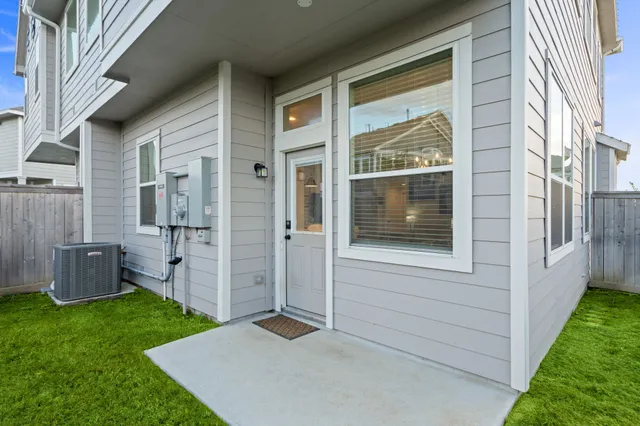 a view of house with backyard