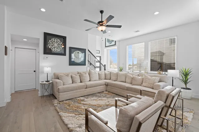 a living room with furniture and a large window