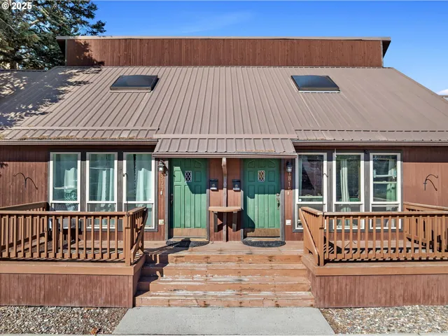 front view of a house with a bench