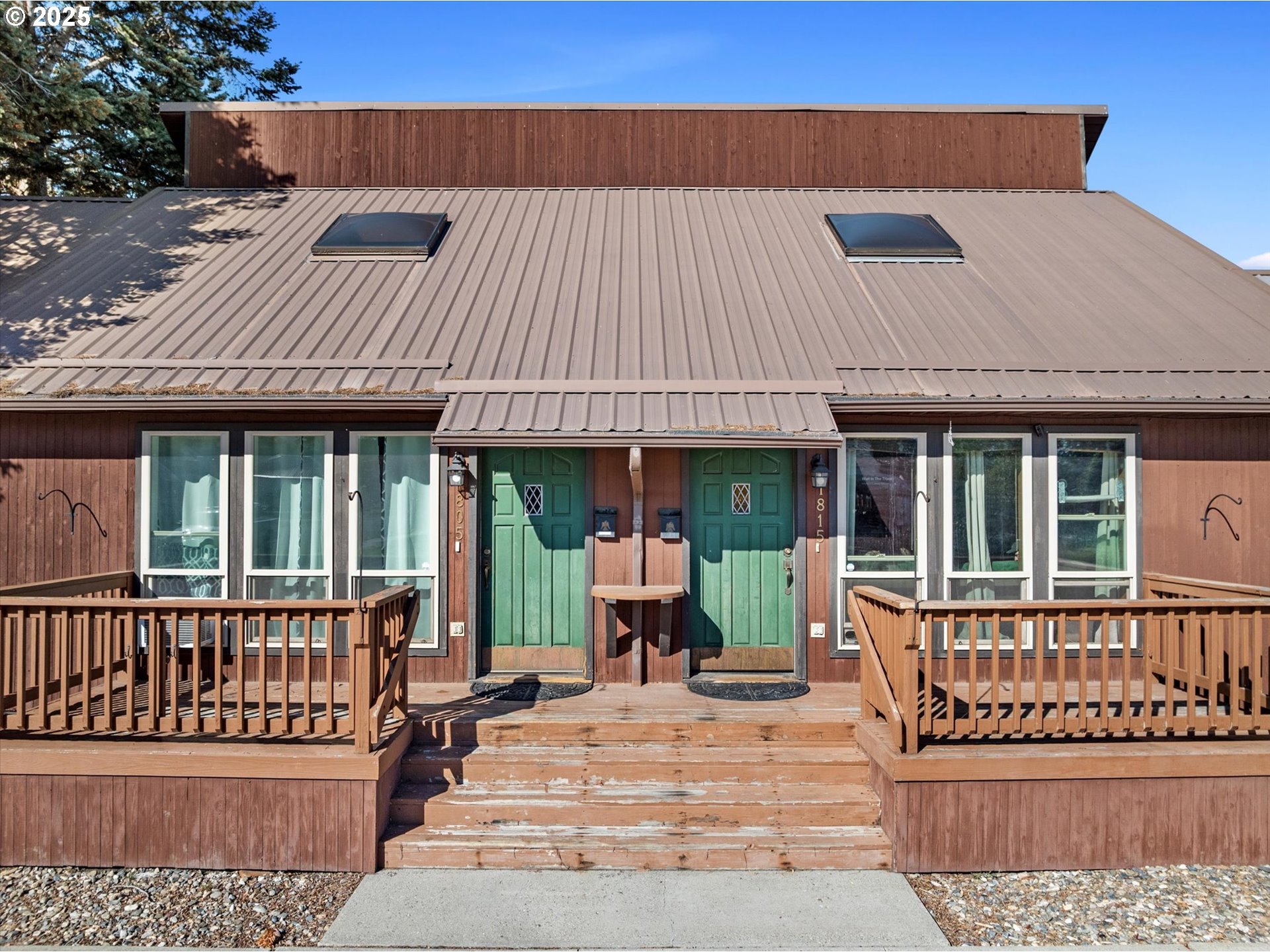 front view of a house with a bench