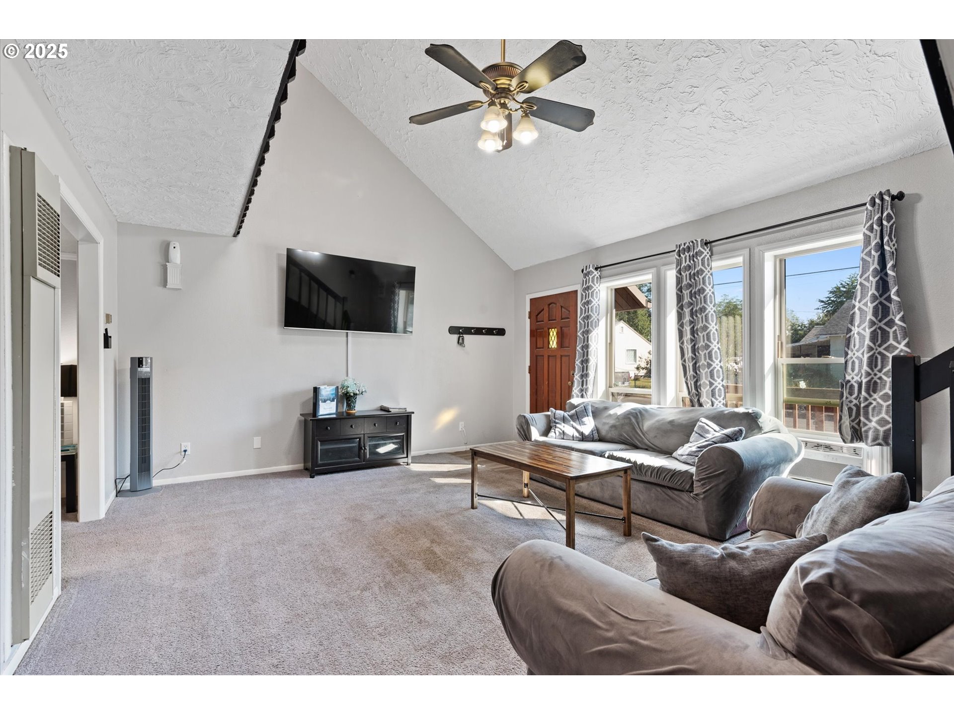 1805 East Street Baker City, OR 97814 - Photo 11 of 45 a living room with furniture and a flat screen tv