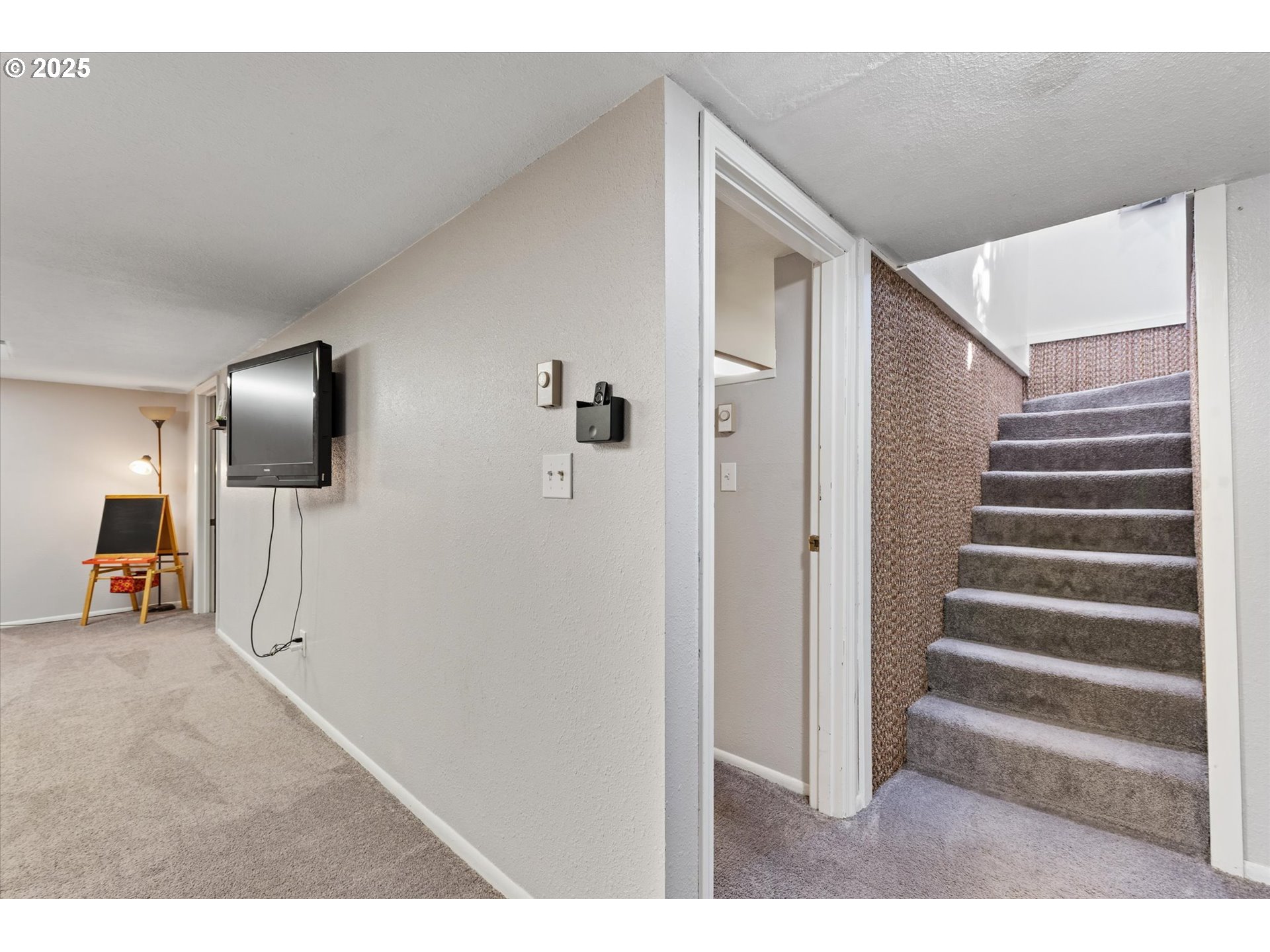 1805 East Street Baker City, OR 97814 - Photo 17 of 45 a view of a livingroom with wooden floor and stairs