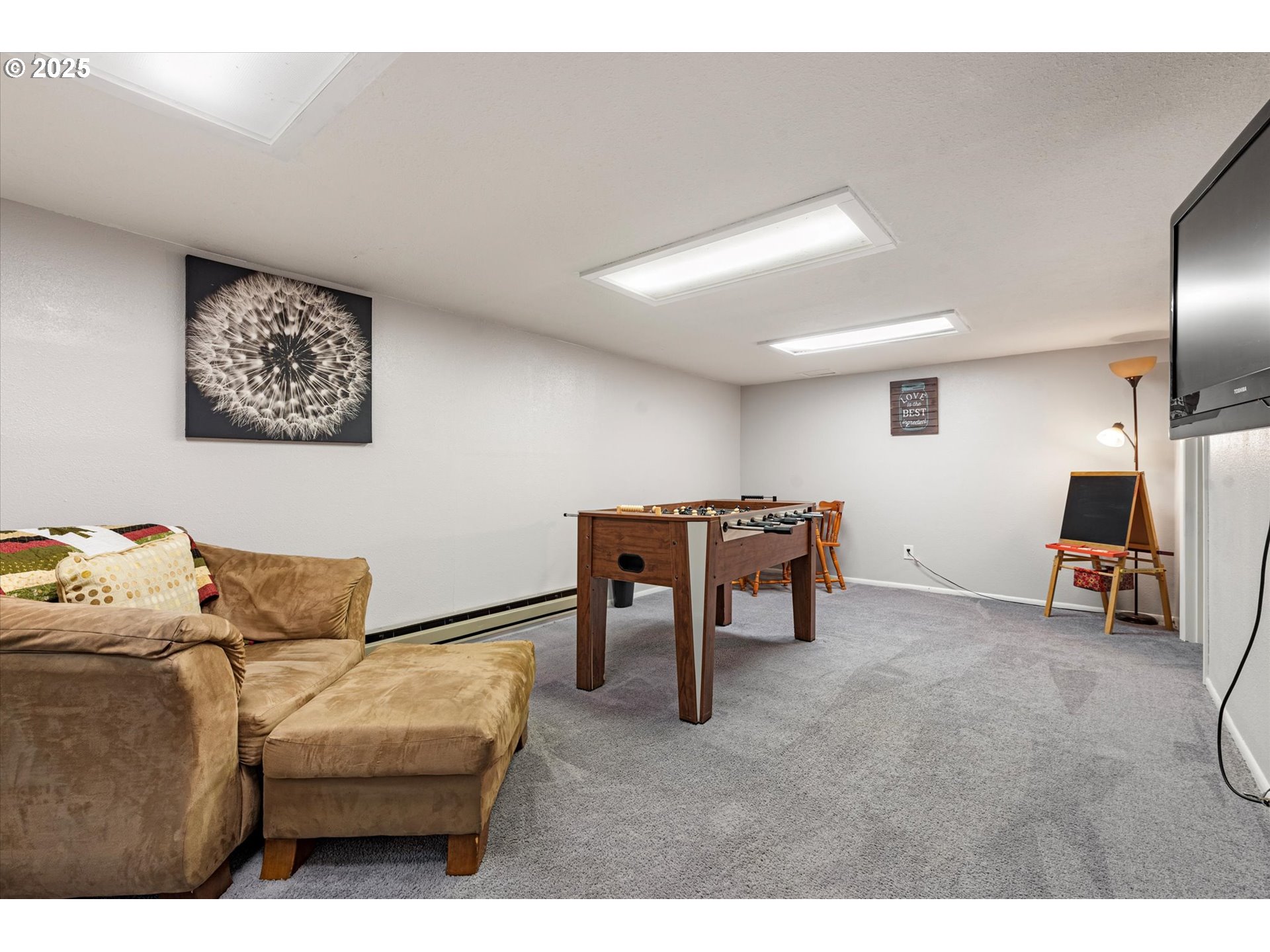 1805 East Street Baker City, OR 97814 - Photo 21 of 45 a living room with furniture and a flat screen tv
