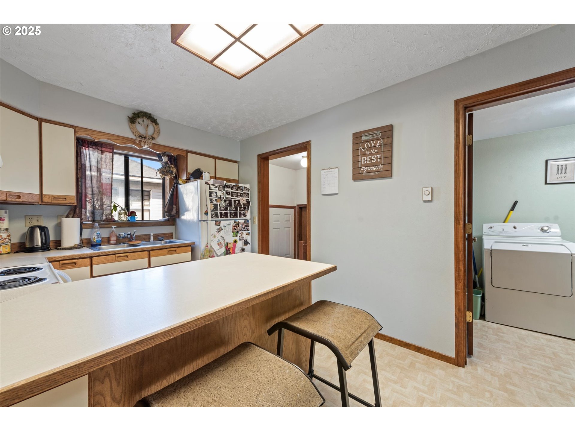 1805 East Street Baker City, OR 97814 - Photo 38 of 45 a living room with stainless steel appliances kitchen island granite countertop furniture and a large window