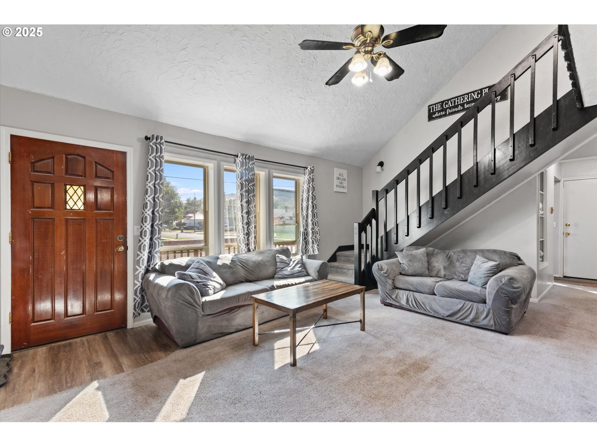 1805 East Street Baker City, OR 97814 - Photo 4 of 45 a living room with furniture ceiling fan and a window