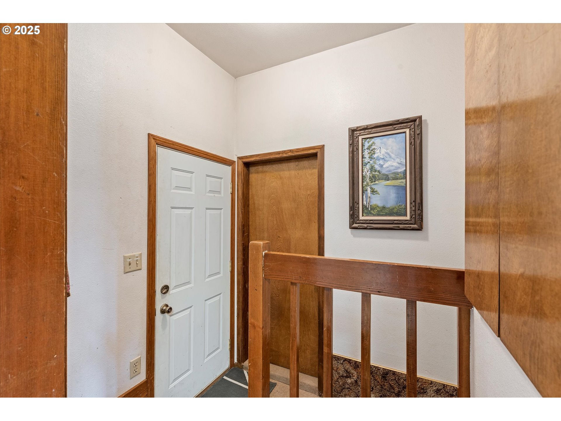 1805 East Street Baker City, OR 97814 - Photo 41 of 45 a view of a hallway with wooden floor and entryway