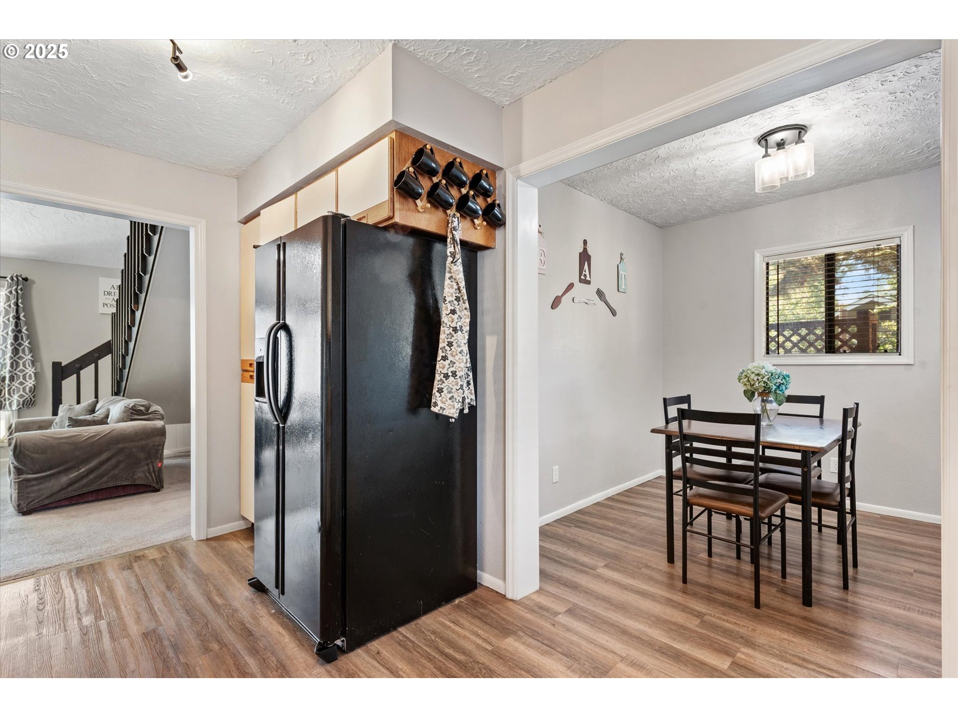 1805 East Street Baker City, OR 97814 - Photo 9 of 45 a view of a dining room with furniture and wooden floor