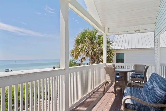 a view of a dining room with furniture wooden floor and chandelier