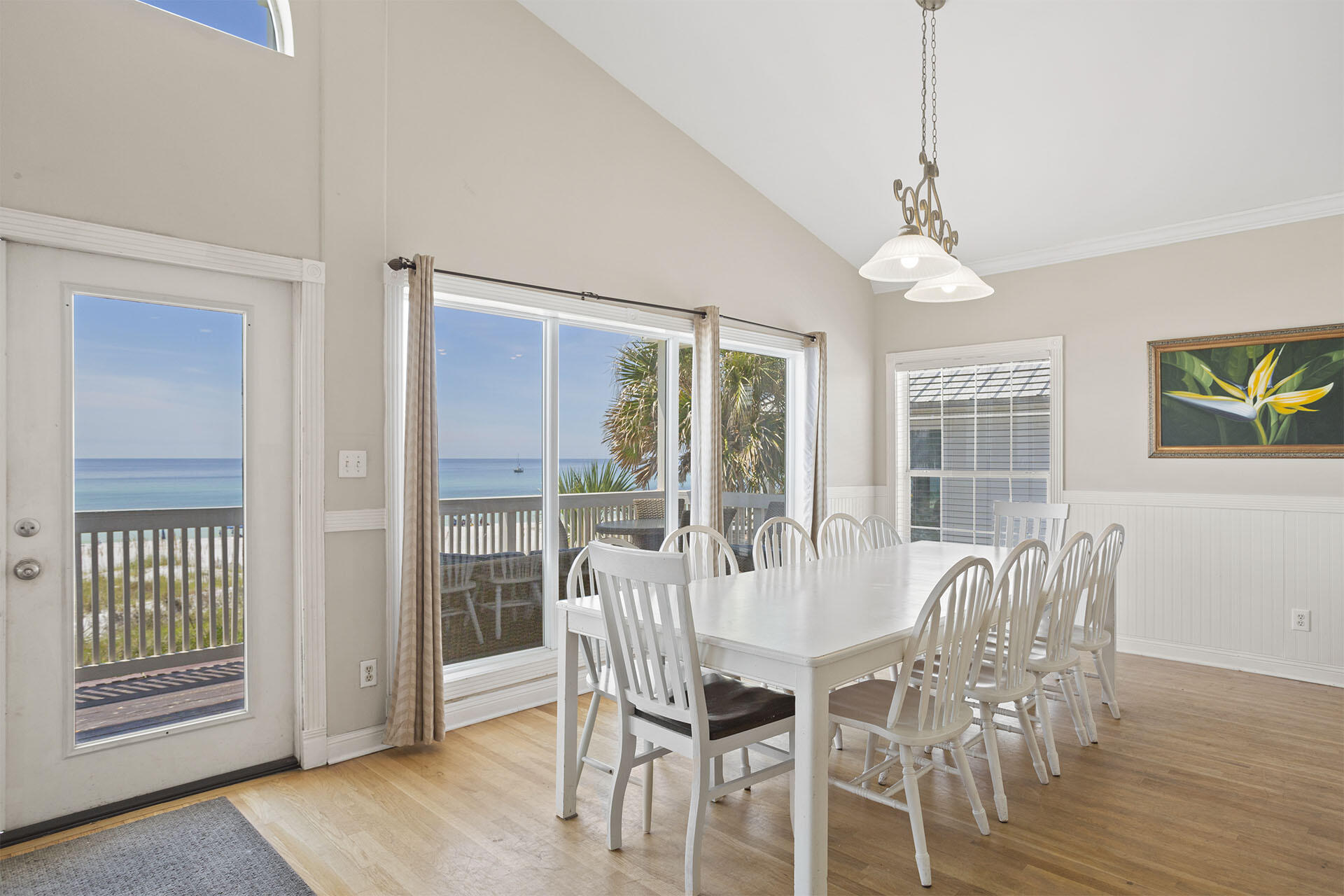 20 Sandy Beach Road Miramar Beach, FL 32550 - Photo 15 of 42 a view of a dining room with furniture wooden floor and chandelier