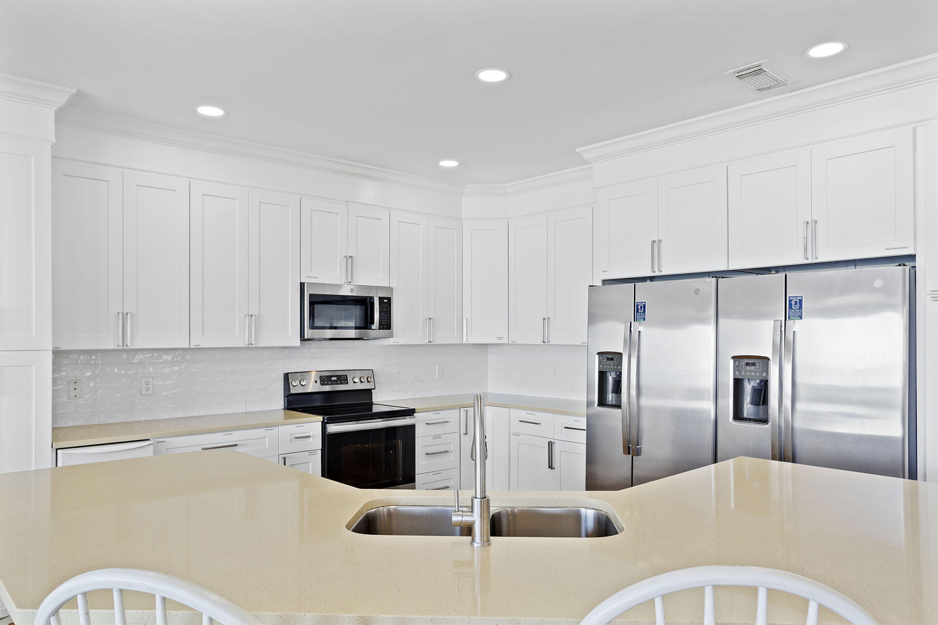 20 Sandy Beach Road Miramar Beach, FL 32550 - Photo 16 of 42 a kitchen with a refrigerator a microwave and cabinets