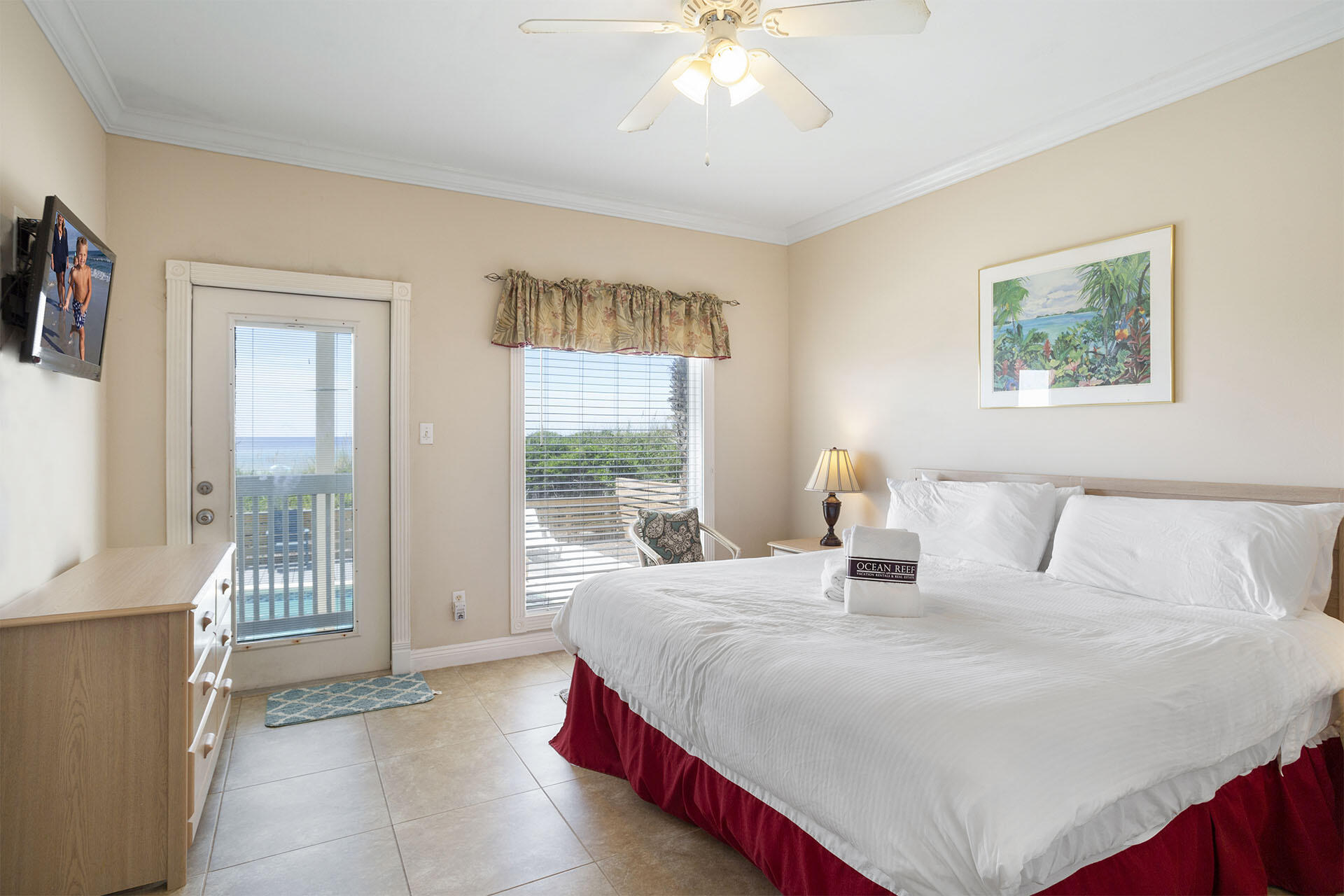 20 Sandy Beach Road Miramar Beach, FL 32550 - Photo 20 of 42 a bedroom with a large bed and a chandelier