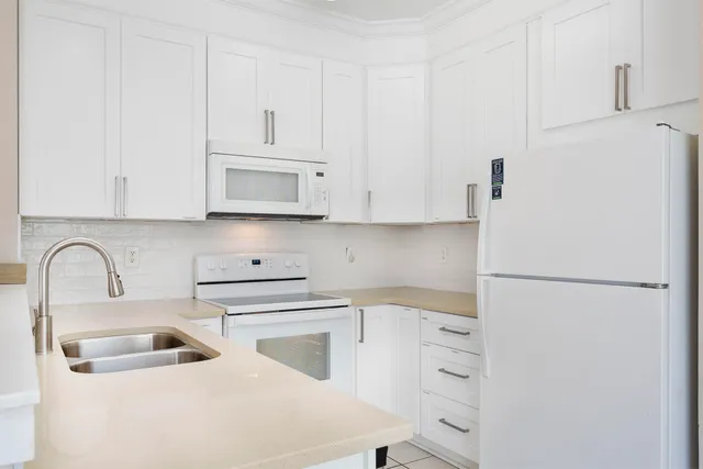 a bedroom with a large bed and a flat screen tv