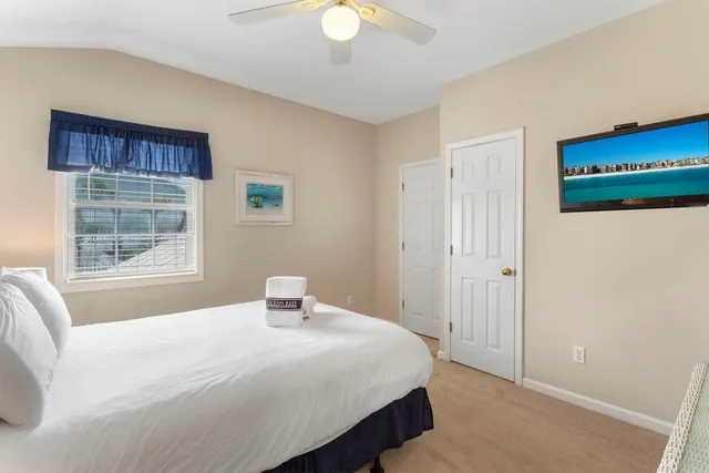 a view of a house with pool and chairs