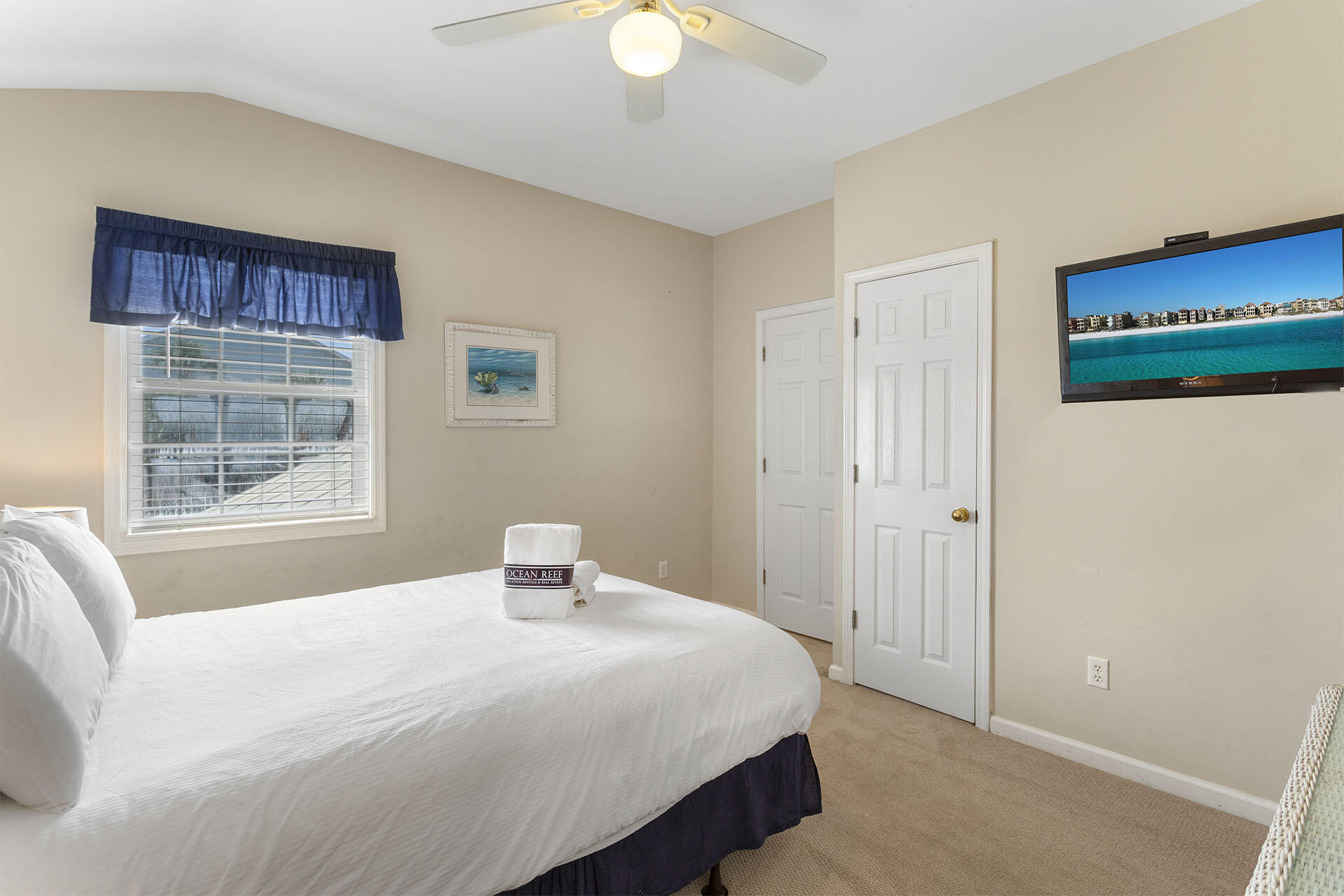 20 Sandy Beach Road Miramar Beach, FL 32550 - Photo 37 of 42 a bedroom with a bed and a chandelier