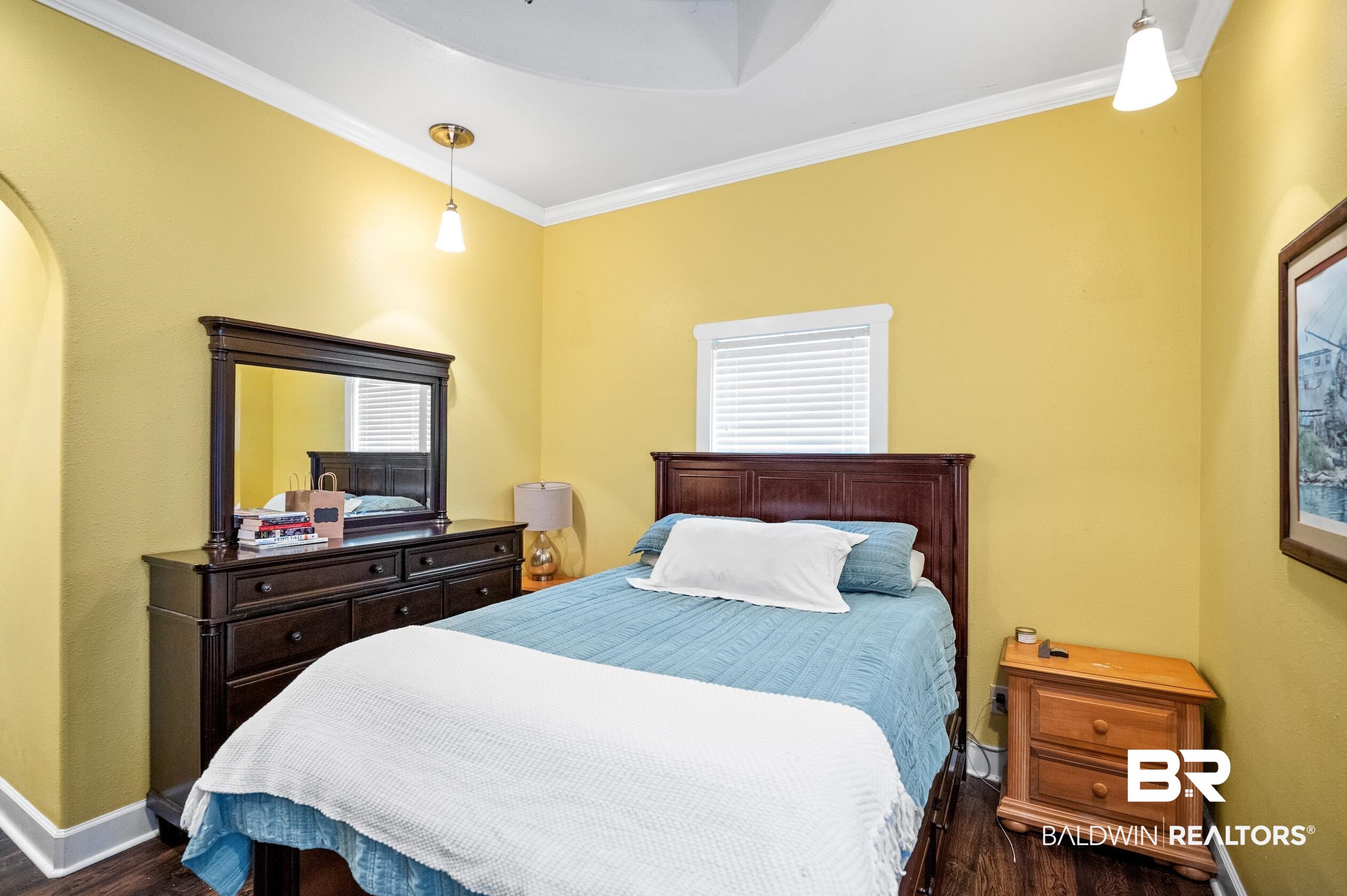 13358 County Road 91 Elberta, AL 36530 - Photo 23 of 47 Bedroom with crown molding and dark wood-type flooring