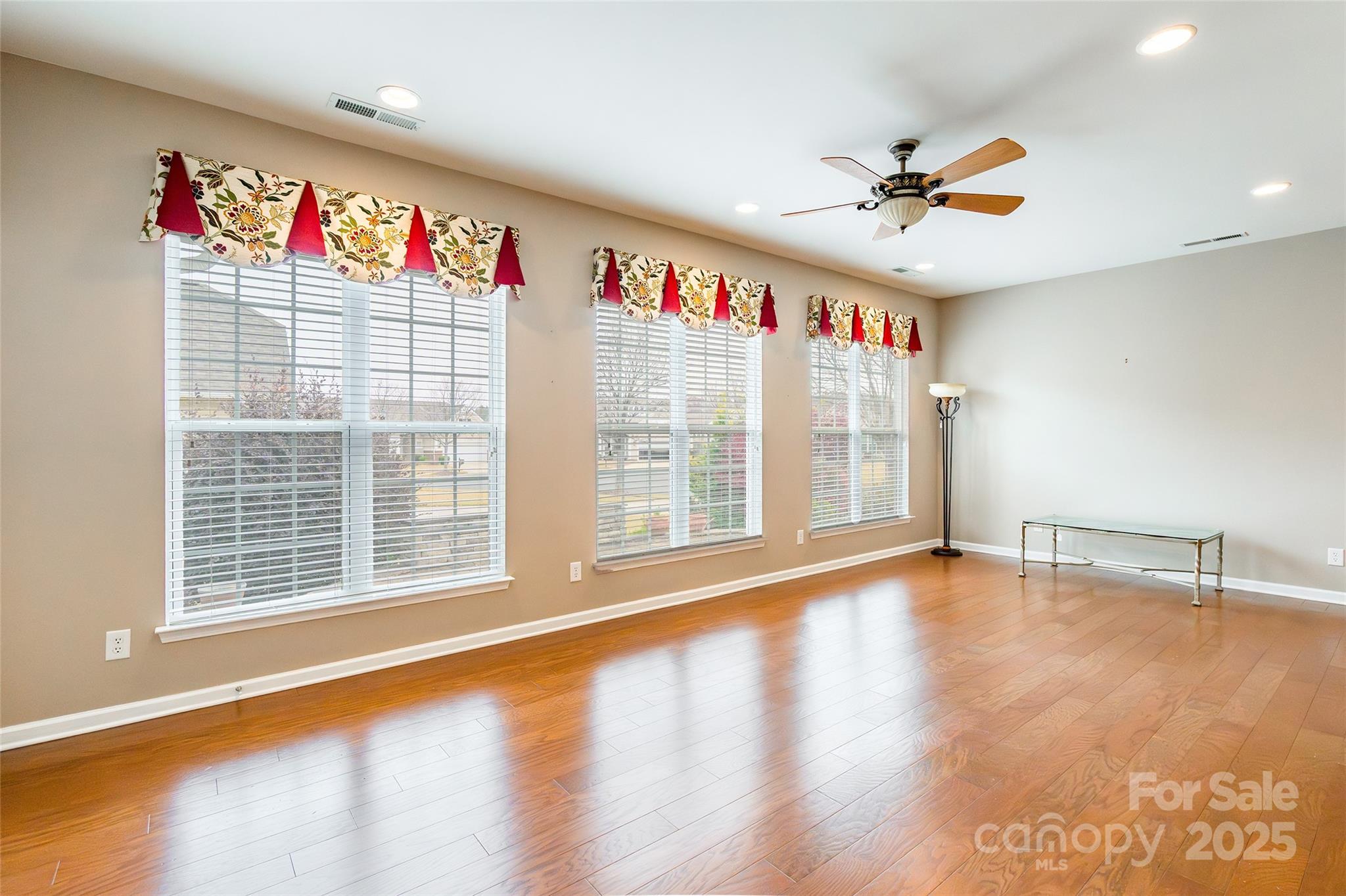 2050 Yellowstone Drive Fort Mill, SC 29707 - Photo 22 of 42 a view of an empty room with a window and wooden floor