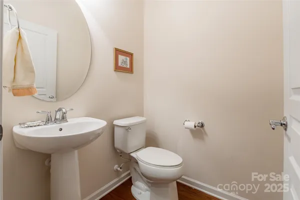 a bathroom with a sink a mirror and a toilet