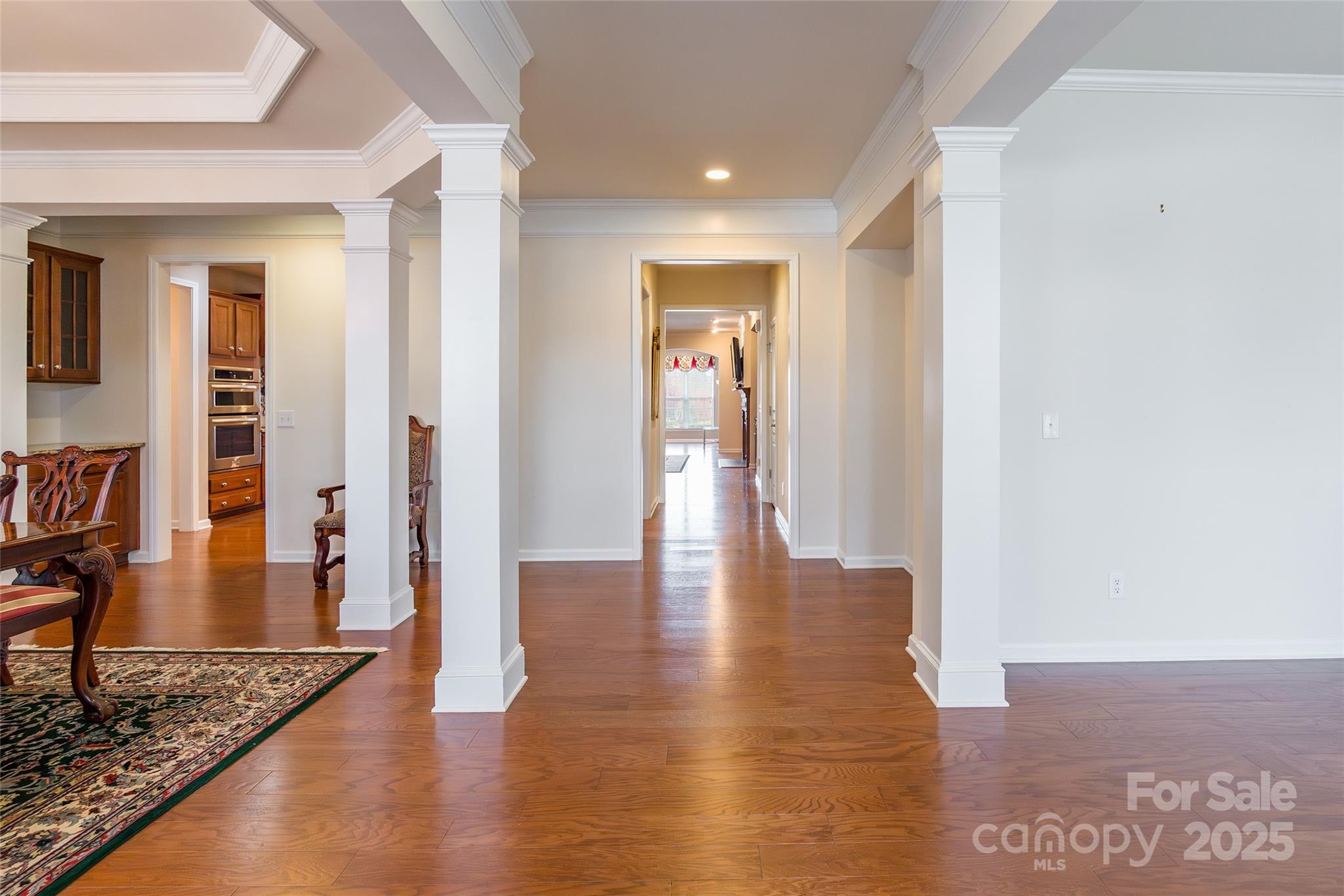 2050 Yellowstone Drive Fort Mill, SC 29707 - Photo 3 of 42 a view of a hallway with wooden floor and furniture