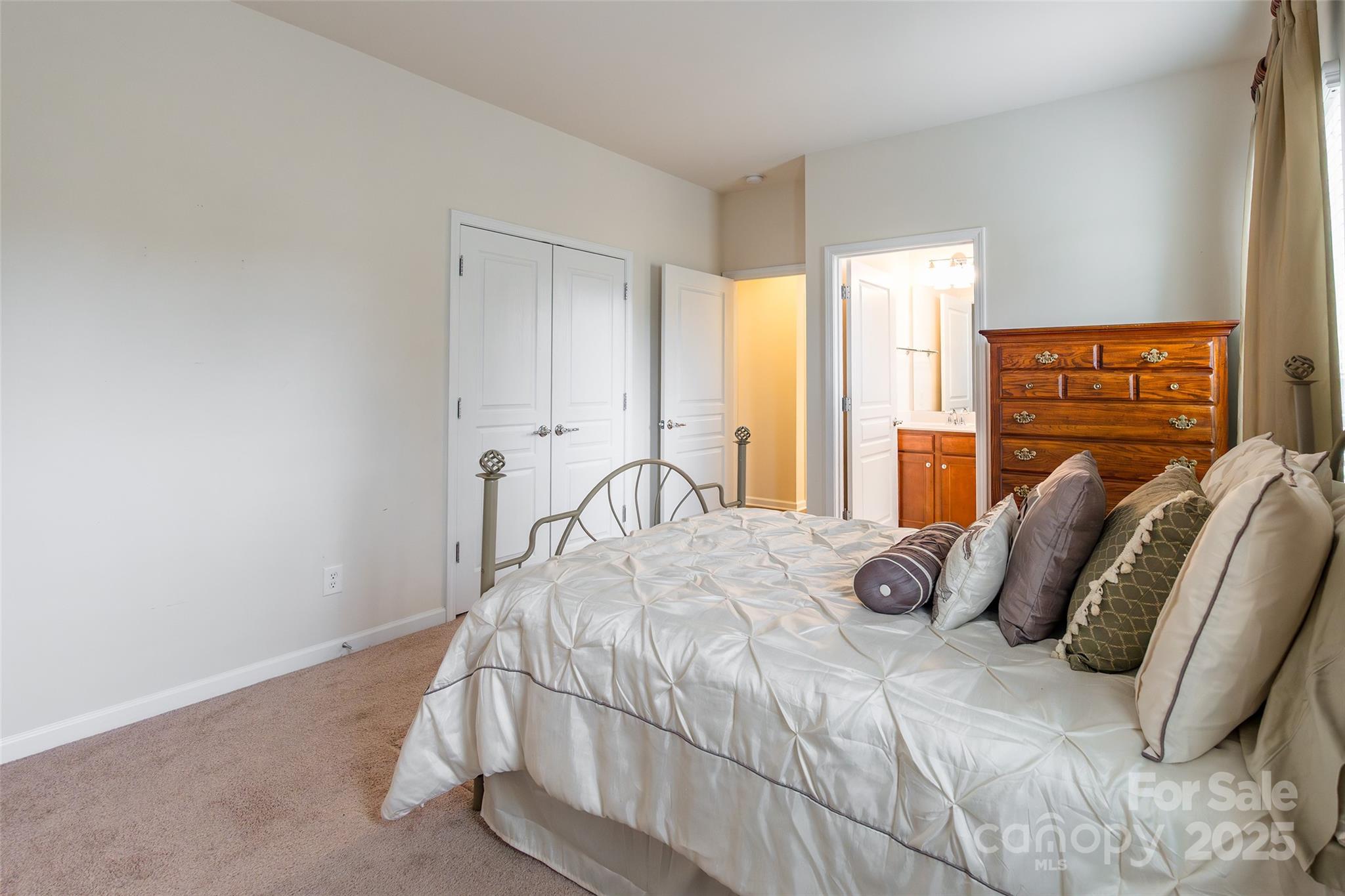 2050 Yellowstone Drive Fort Mill, SC 29707 - Photo 35 of 42 a bed sitting in a bedroom next to a window