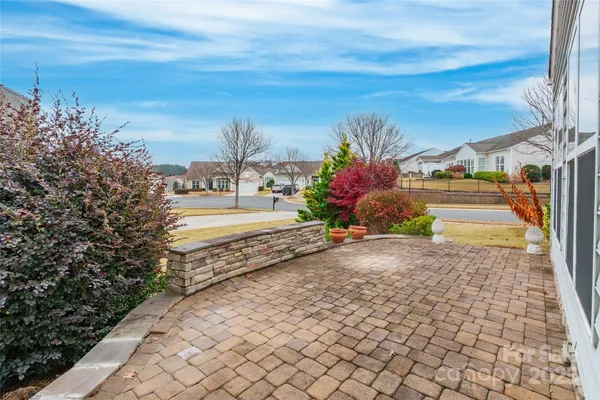 a view of a pathway with a yard