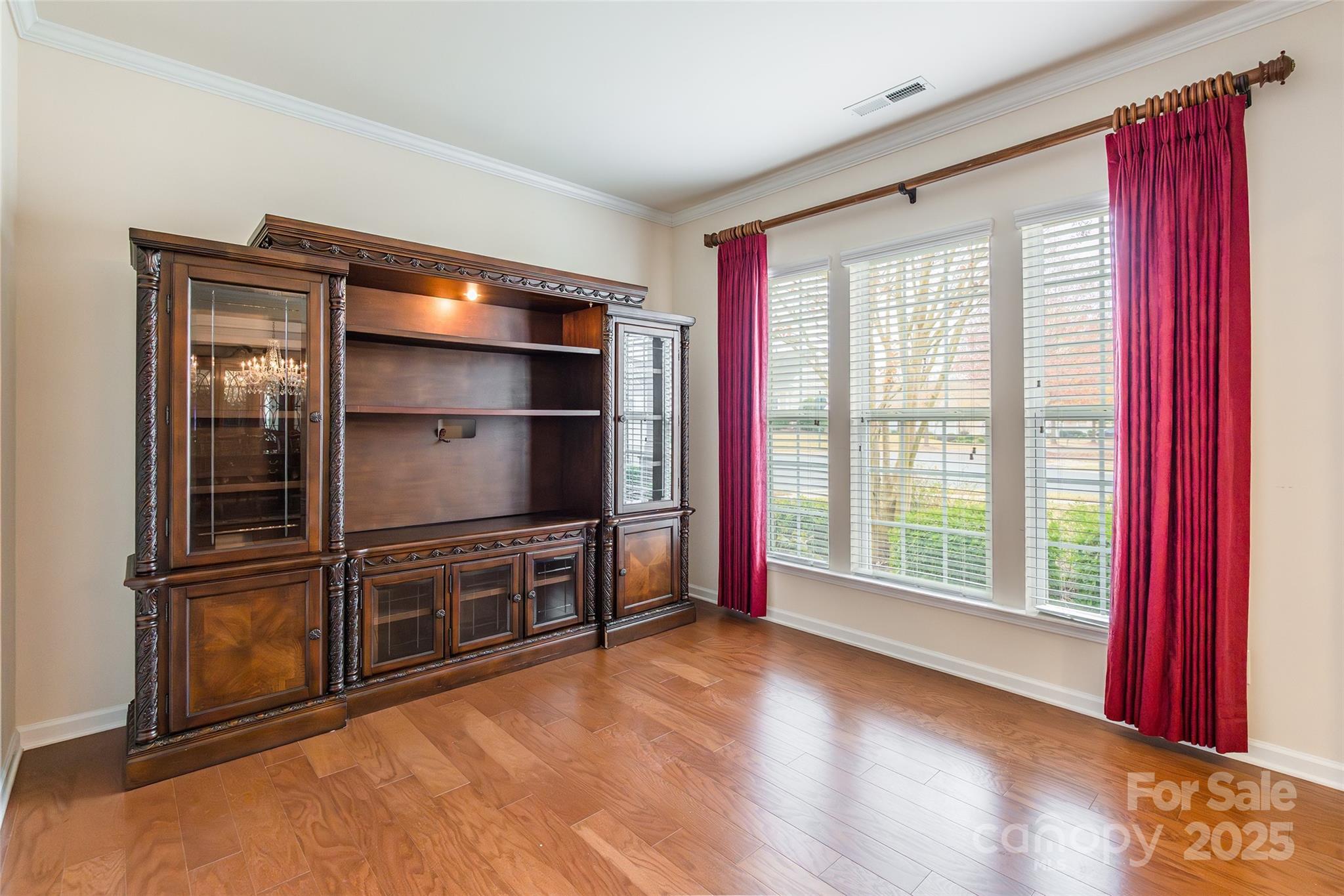 2050 Yellowstone Drive Fort Mill, SC 29707 - Photo 6 of 42 a view of an empty room with wooden floor and a window