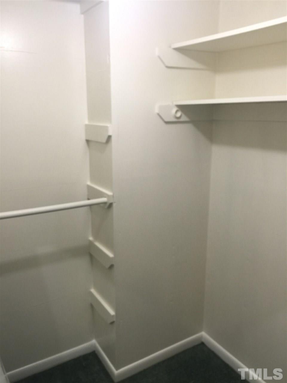 706 Godwin Court Raleigh, NC 27606 - Photo 12 of 19 a view of small space with racks on the wall