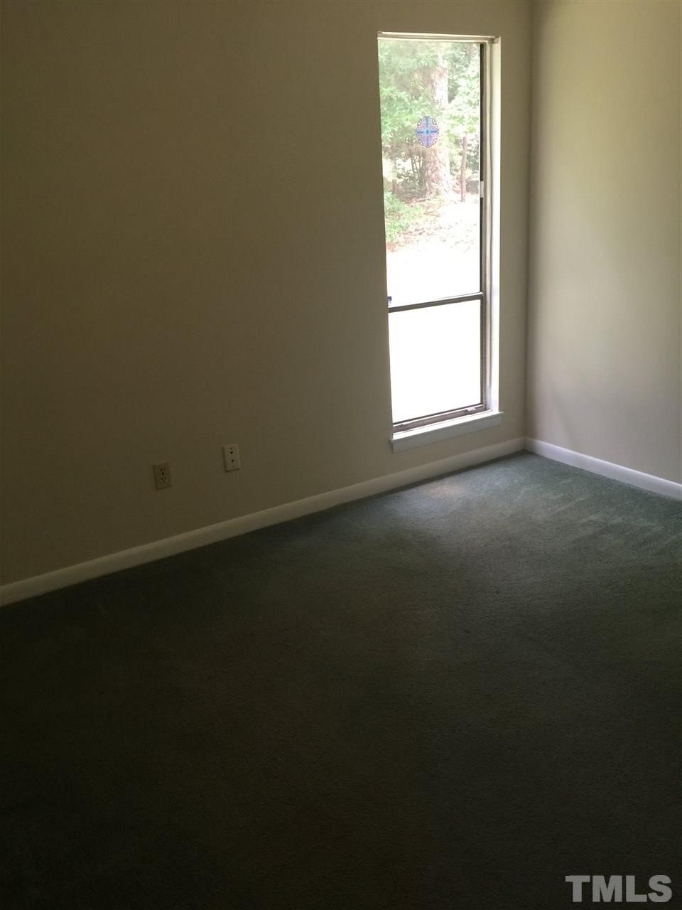 706 Godwin Court Raleigh, NC 27606 - Photo 15 of 19 an empty room with a window