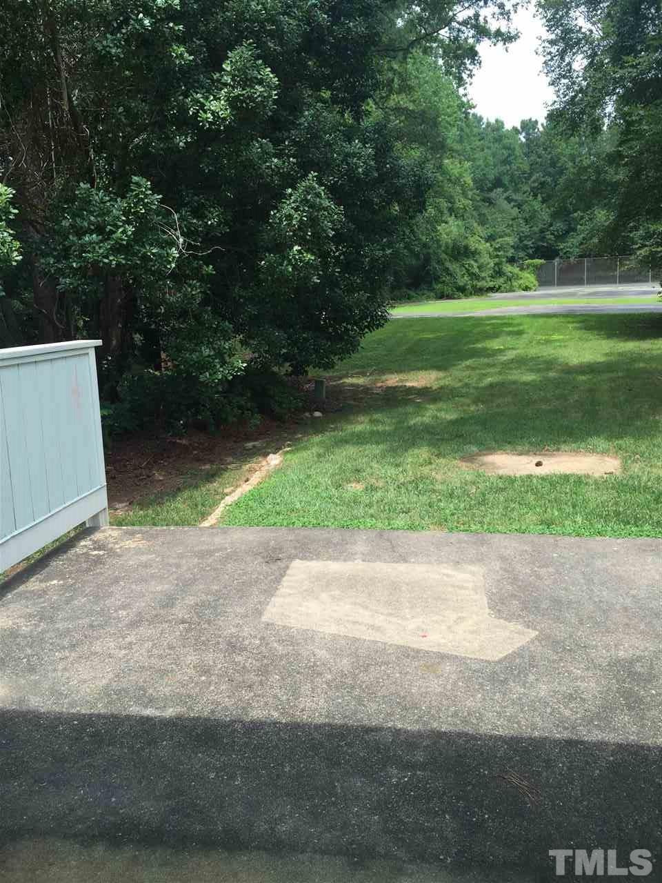 706 Godwin Court Raleigh, NC 27606 - Photo 18 of 19 a view of outdoor space with garden