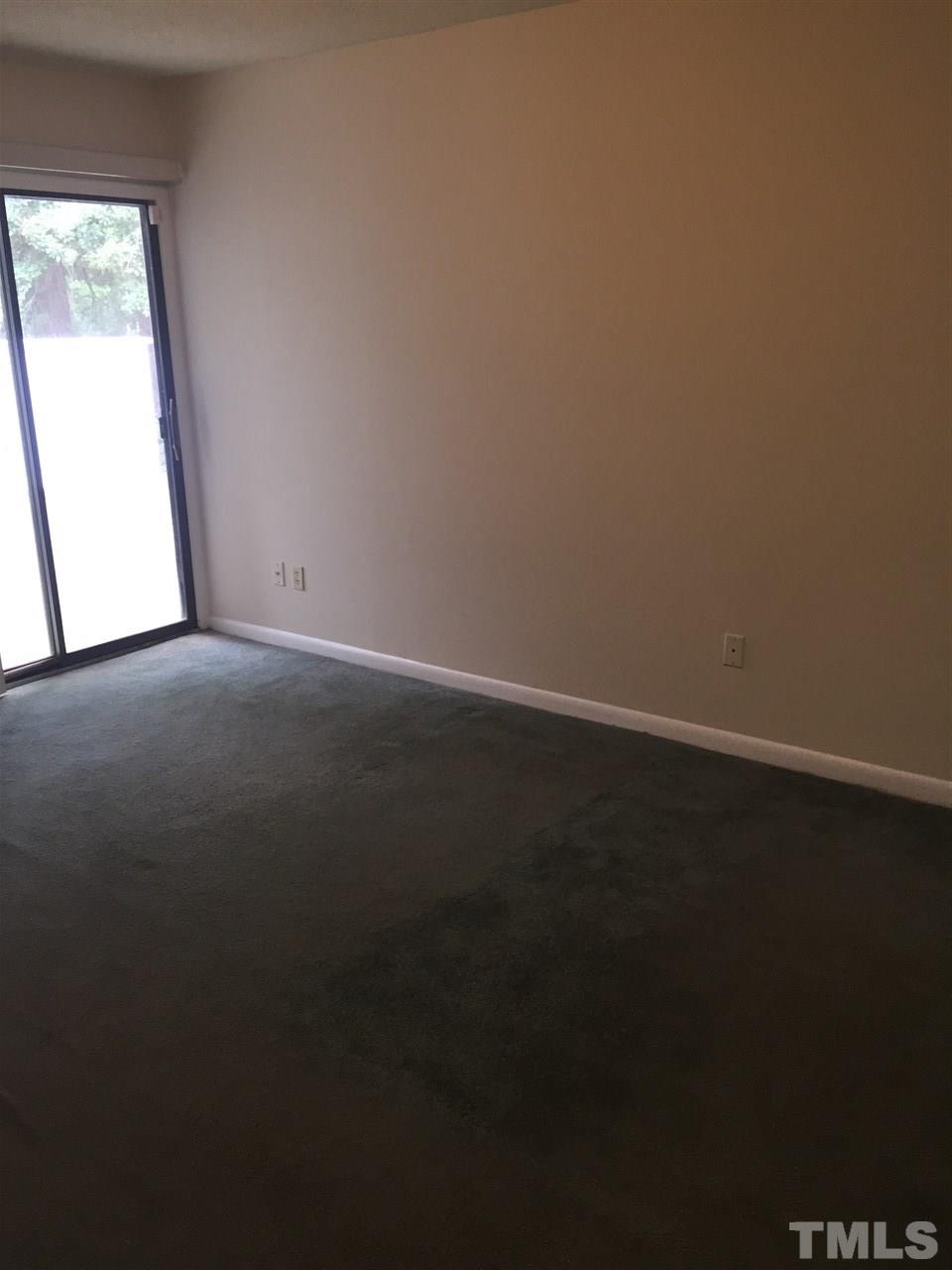 706 Godwin Court Raleigh, NC 27606 - Photo 10 of 19 an empty room with a window
