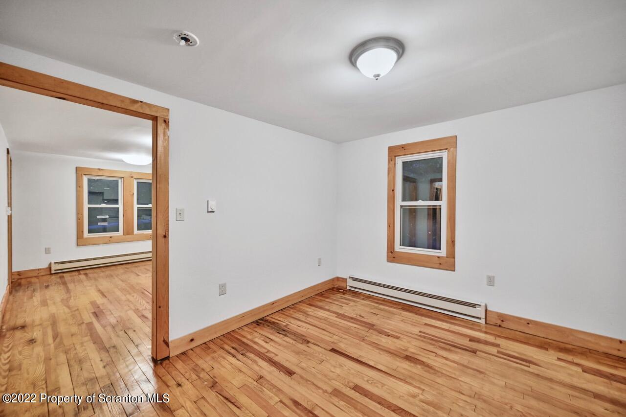 549 Gravity Road Lake Ariel, PA 18436 - Photo 20 of 62 a view of an empty room with wooden floor and a window