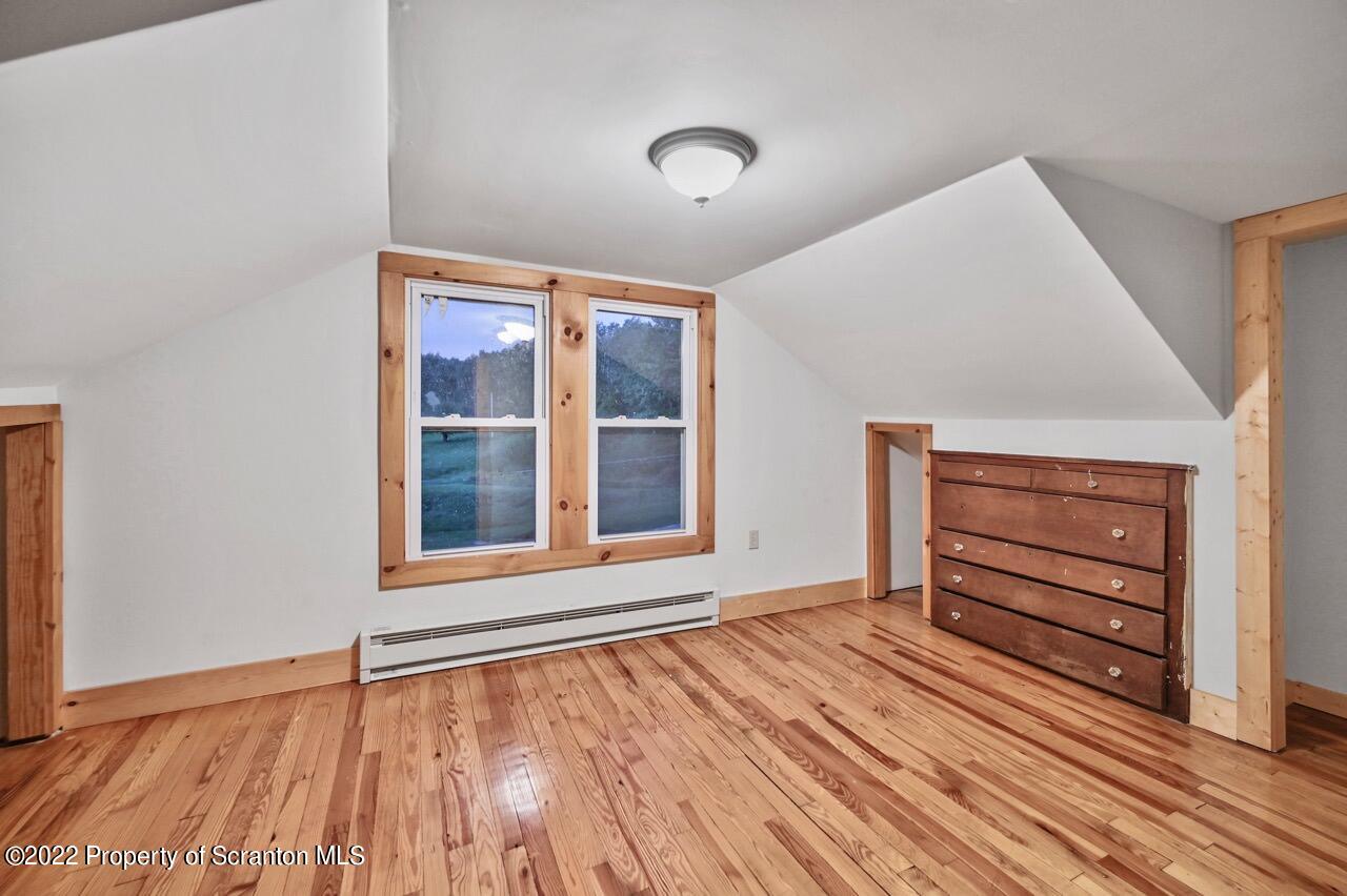 549 Gravity Road Lake Ariel, PA 18436 - Photo 47 of 62 a view of an empty room with wooden floor and a window