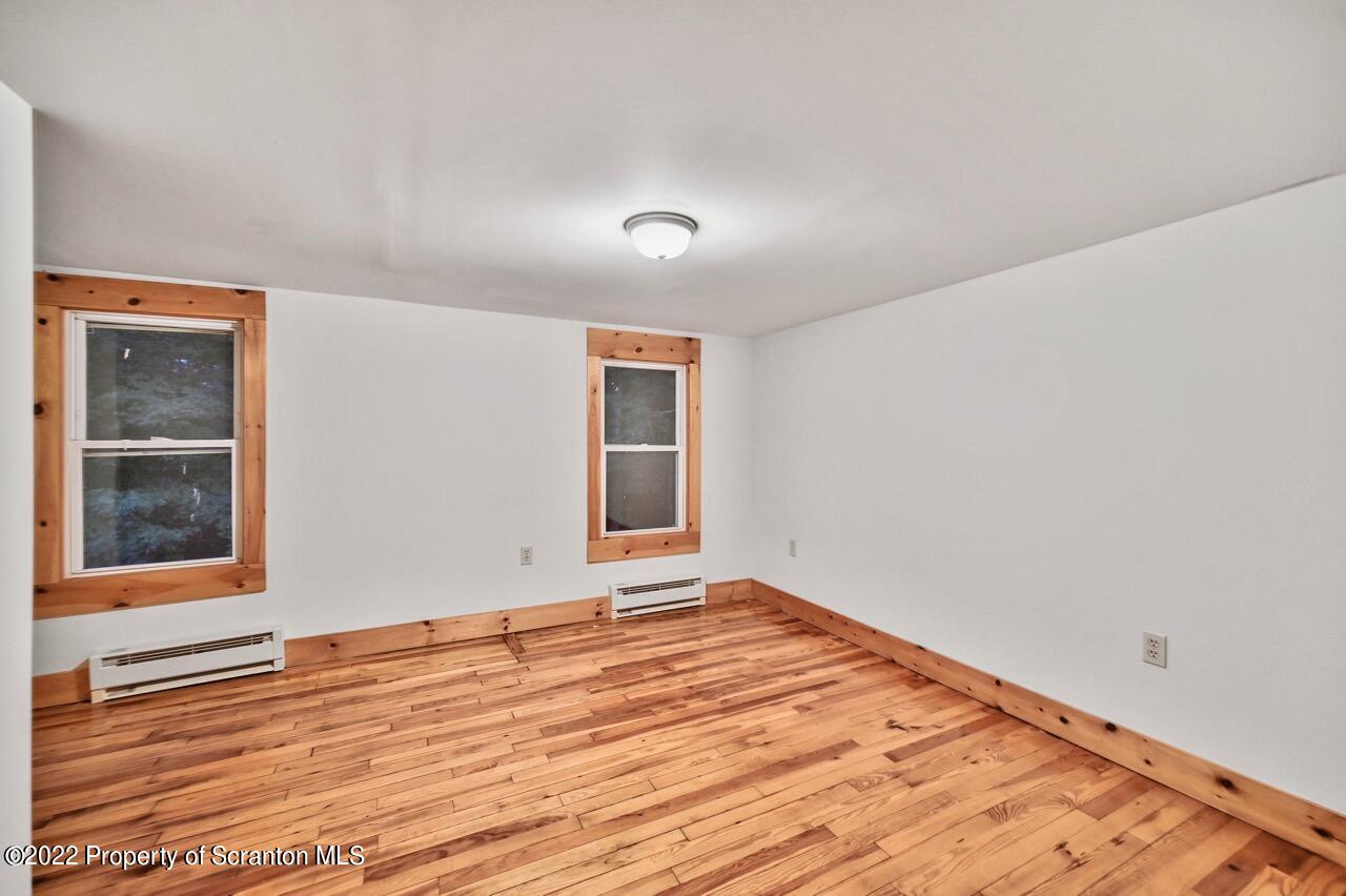 549 Gravity Road Lake Ariel, PA 18436 - Photo 49 of 62 a view of an empty room with wooden floor and a window
