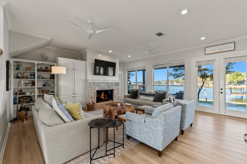 258 Sunset Point Mabank, TX 75156 - Photo 11 of 40 a living room with furniture fireplace and a flat screen tv