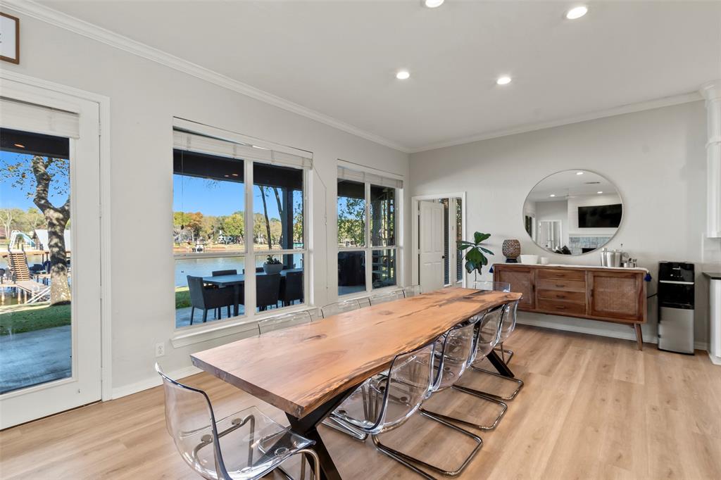 258 Sunset Point Mabank, TX 75156 - Photo 12 of 40 a view of a dining room with furniture window and wooden floor
