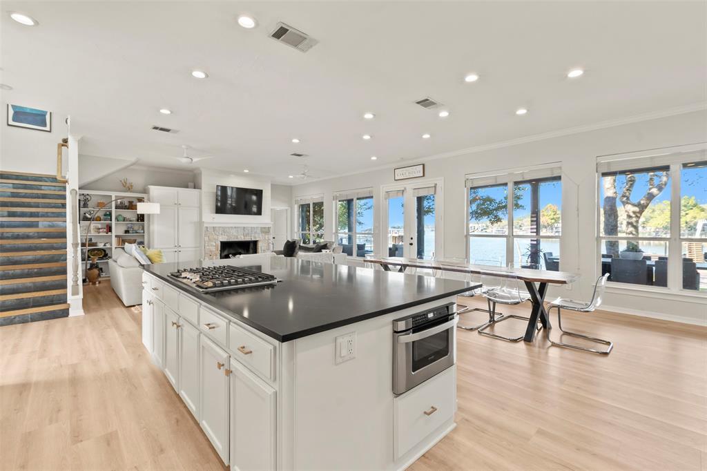 258 Sunset Point Mabank, TX 75156 - Photo 15 of 40 a kitchen with stainless steel appliances granite countertop a sink a stove and a wooden floors