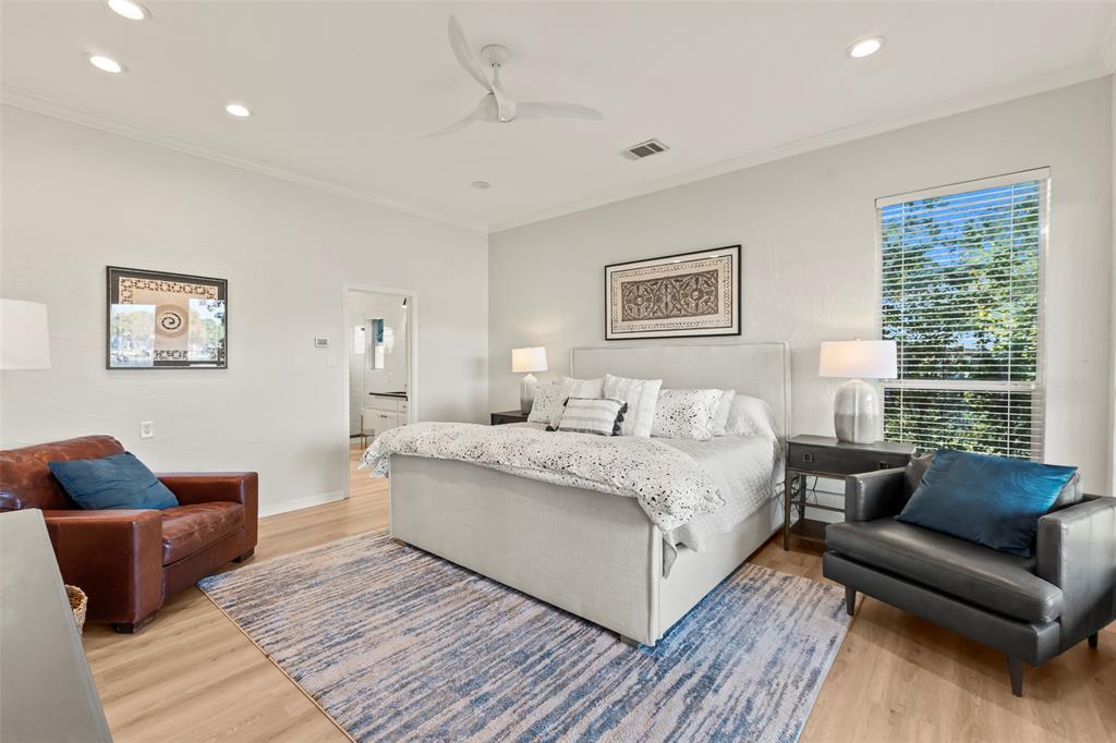 258 Sunset Point Mabank, TX 75156 - Photo 16 of 40 a spacious bedroom with a bed a couch and a large window