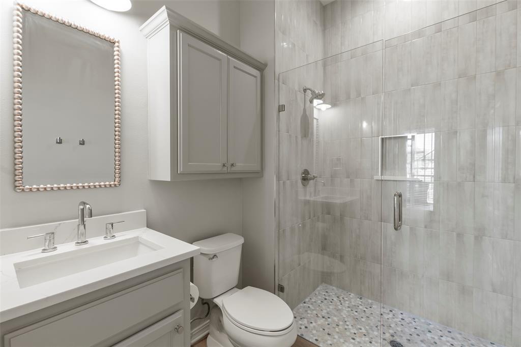 258 Sunset Point Mabank, TX 75156 - Photo 20 of 40 a bathroom with a sink a toilet and shower