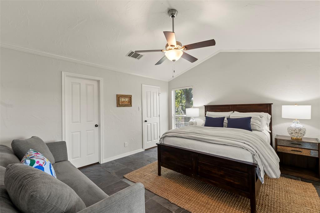 258 Sunset Point Mabank, TX 75156 - Photo 26 of 40 a bedroom with a bed and a chandelier