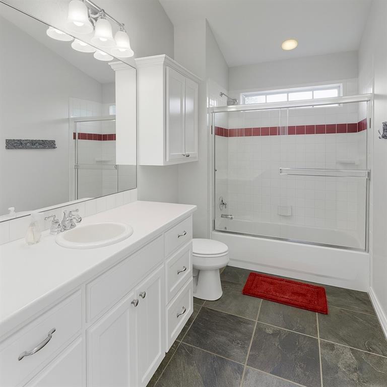 258 Sunset Point Mabank, TX 75156 - Photo 29 of 40 a bathroom with a sink and a mirror