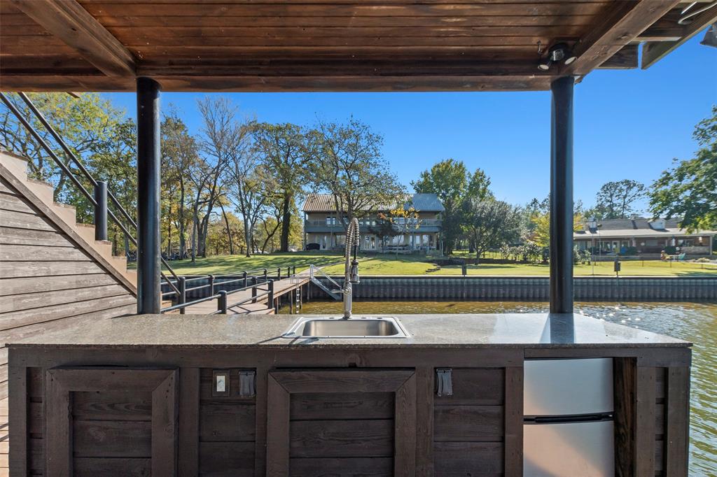 258 Sunset Point Mabank, TX 75156 - Photo 35 of 40 a view of a two chair and table in the balcony