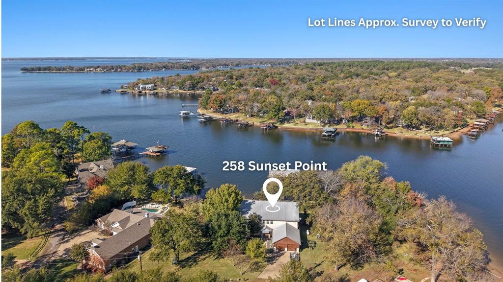 258 Sunset Point Mabank, TX 75156 - Photo 38 of 40 an aerial view of a house with a lake view