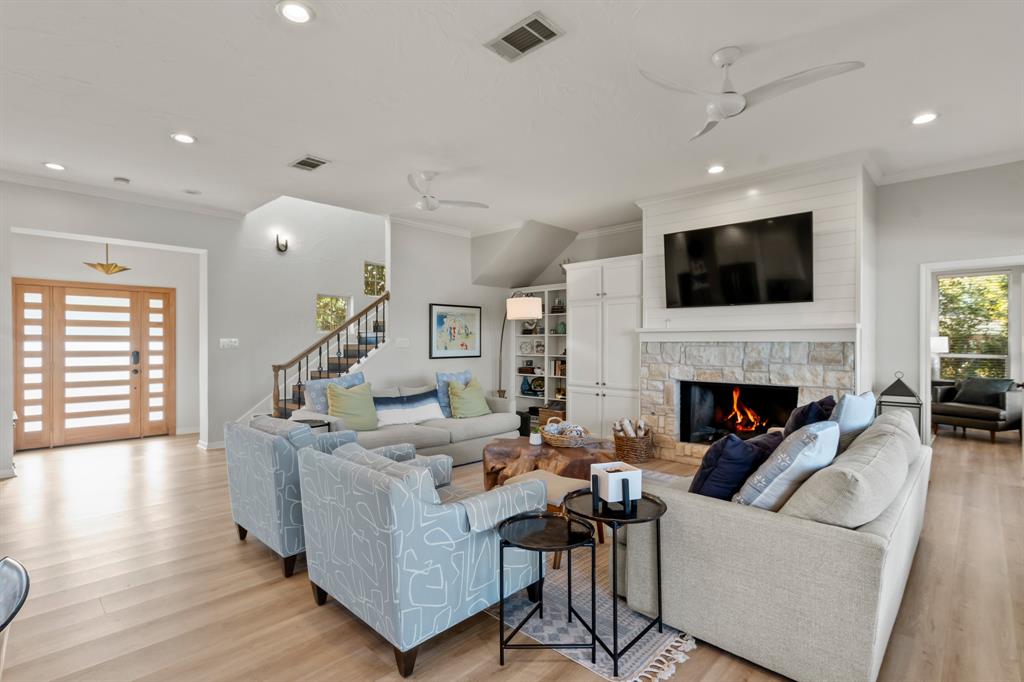 258 Sunset Point Mabank, TX 75156 - Photo 10 of 40 a living room with furniture a fireplace and a flat screen tv
