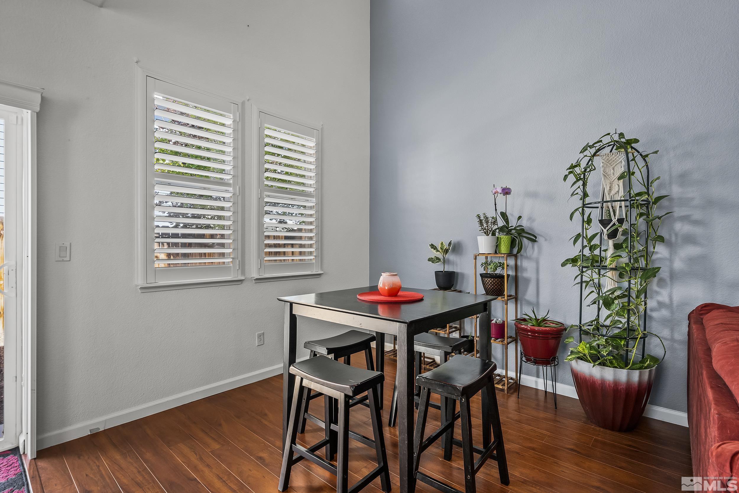 2115 Stanton Lane Reno, NV 89502 - Photo 11 of 18 a view of a dining room with furniture and wooden floor