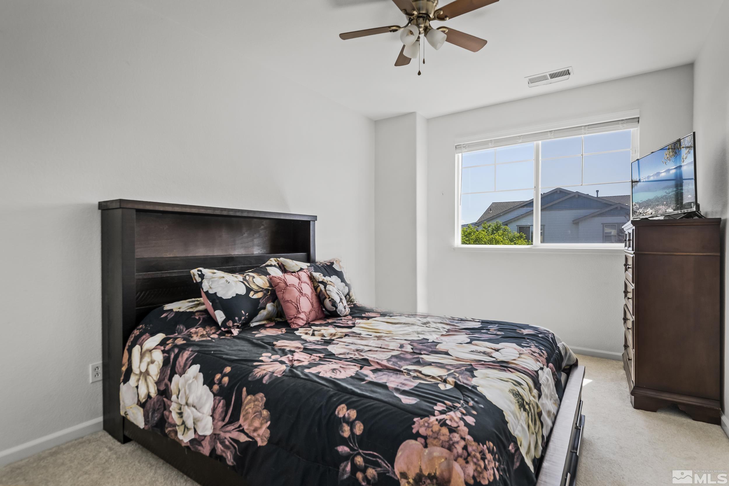 2115 Stanton Lane Reno, NV 89502 - Photo 12 of 18 a bedroom with a bed and a window