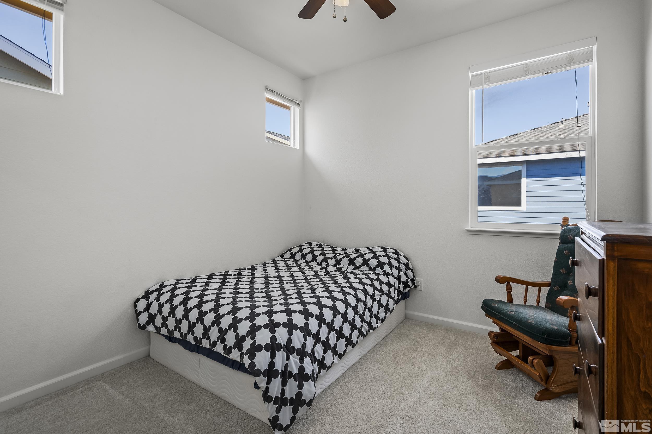 2115 Stanton Lane Reno, NV 89502 - Photo 14 of 18 a bedroom with bed and a window