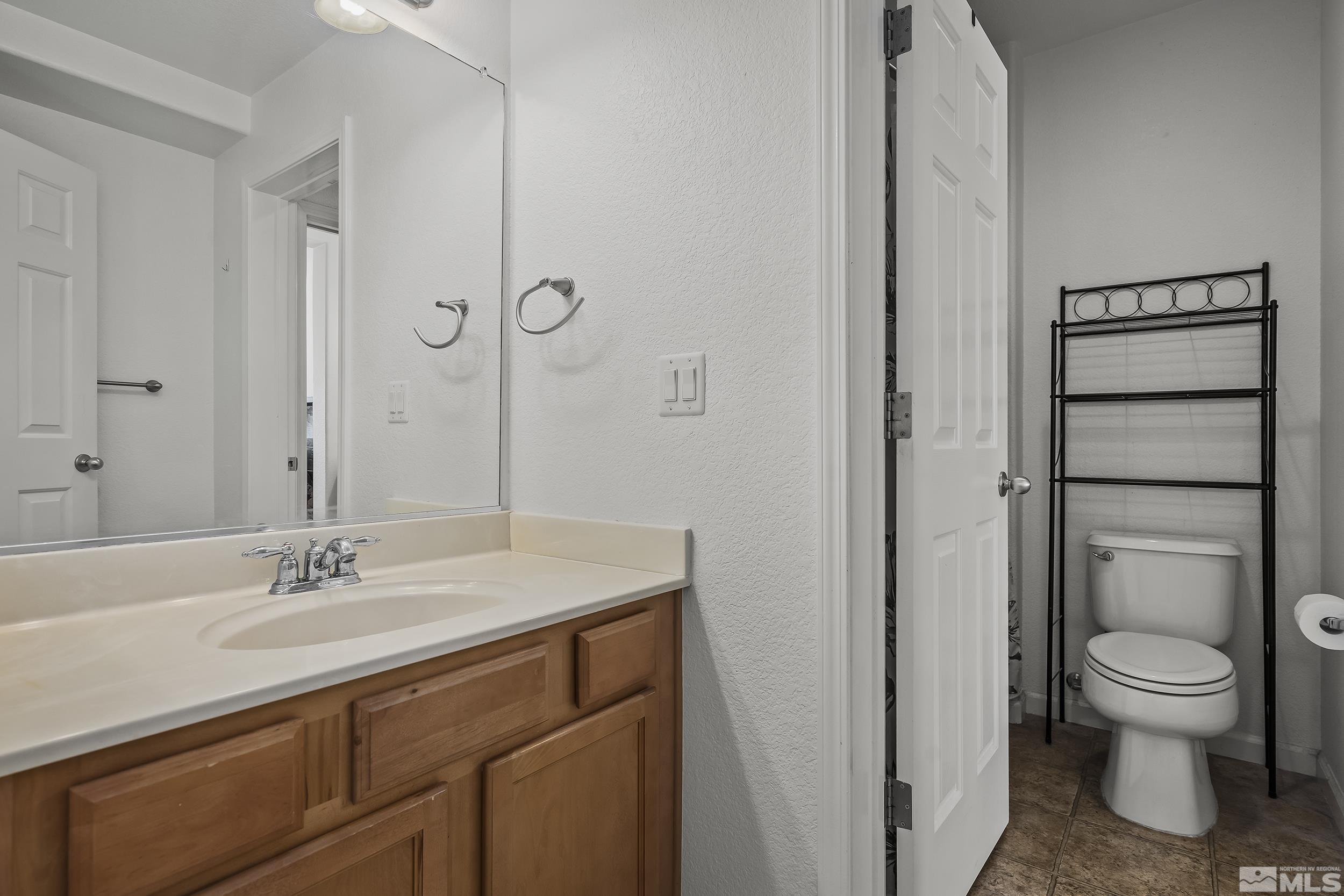 2115 Stanton Lane Reno, NV 89502 - Photo 15 of 18 a bathroom with a sink toilet and shower